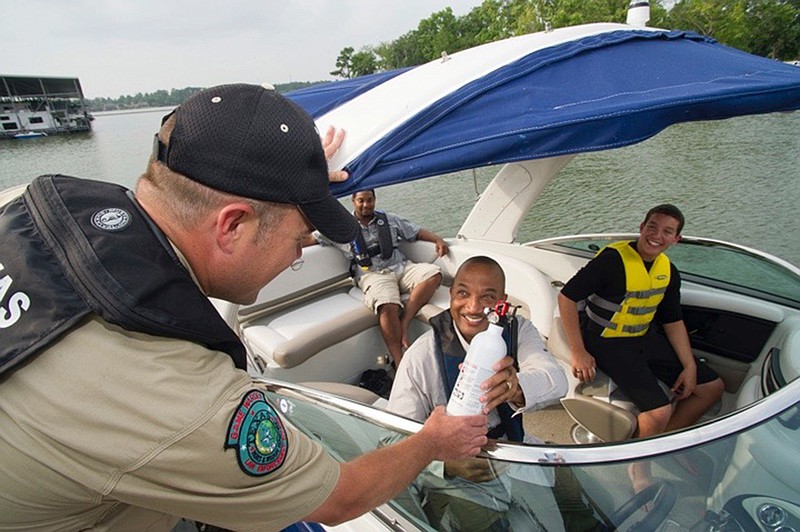 A Texas game warden checks with boaters to ensure they have proper emergency supplies. (Submitted photo)