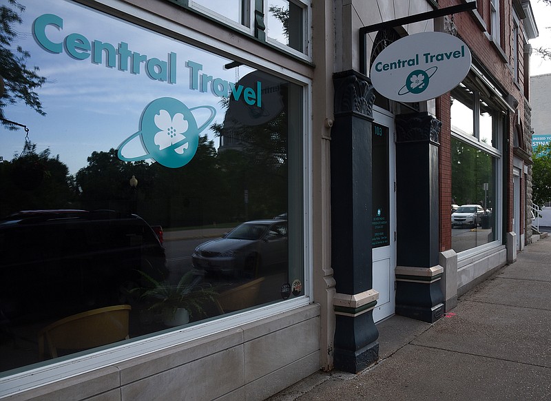 
The Central Travel building at 103 W. High St. is shown next to the vacant building of 105 W. High St. on Friday, May 25, 2018. The vacant building at 105 W. High St. will be occupied by Central Bank and contain a new office.