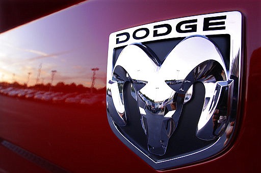 This Aug. 15, 2010 file photo shows a Dodge Ram logo at a dealership in Springfield, Ill. Fiat Chrysler is recalling 4.8 million vehicles in the U.S. because in rare but terrifying circumstances, drivers may not be able to turn off the cruise control. Affected models include the 2014-2019 Ram 1500 pickup, as well as the 2014-2018 Ram 2500, 3500, 4500 and 5500 pickups and chassis cab trucks.  (AP Photo/Seth Perlman, File)