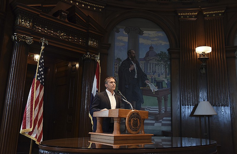 Gov. Eric Greitens reads from a prepared statement as he announces his resignation effective 5 p.m. Friday, June 1, 2018, during a hastily called press conference Tuesday, May 29, 2018, in his Capitol office in Jefferson City, Missouri.
