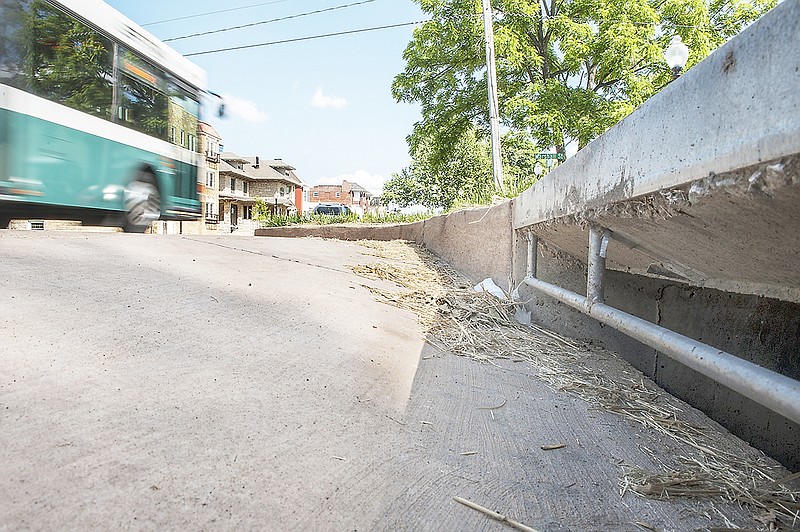 Grass clippings are seen near a stormwater drain Wednesday. Jefferson City is reminding residents to avoid blowing grass clippings, trash and other waste into the streets and stormwater drains this spring and summer.