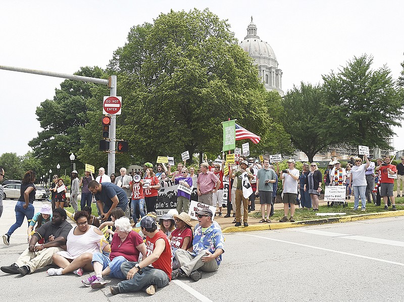 In their fourth week of protesting, the Poor People's Campaign focuses on the environment and called for an end to environmental practices they claim harm poor and minority populations. Several people spoke at the Capitol corner rally after which they performed an act of civil disobedience by blocking the West High Street and Broadway Street intersection.