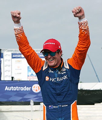 Scott Dixon celebrates after winning Saturday's first race of the IndyCar Detroit Grand Prix doubleheader in Detroit.