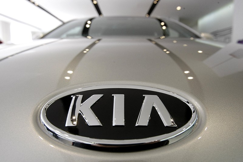 FILE - In this Jan. 28, 2011 file photo, KIA Motors logo is seen on a K7 sedan at a showroom in Seoul, South Korea.  Kia is recalling over a half-million vehicles in the U.S. because the air bags may not work in a crash. The recall apparently is related to federal investigation into air bag failures in Kia and partner Hyundai vehicles that were linked to four deaths. Vehicles covered by the recall include 2010 through 2013 Forte compact cars and 2011 through 2013 Optima midsize cars. Also covered are Optima Hybrid and Sedona minivans from 2011 and 2012.(AP Photo/Ahn Young-joon, File)