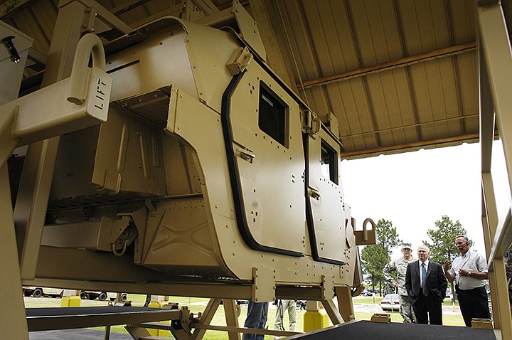 Secretary of Defense Robert M. Gates watches a HMMWV Egress Assistance Trainer (HEAT) demonstration during a visit to the Red River Army Depot near Texarkana, Texas, May 2, 2008.