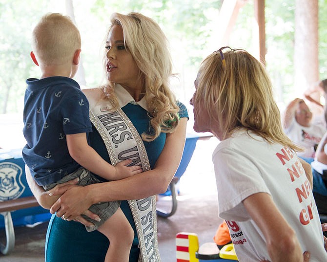 Lauren Ziegler, center, and her son Wesley Ziegler, 3, talk with Judy Courtney, right, at the end of the 11th annual Missouri's Missing and Unidentified Persons Awareness Day Saturday at the Memorial Park Pavilion. Ziegler, Mrs. United States 2017, spoke during the event and Courtney is a board member of Missouri Missing.