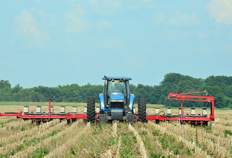 2018 FILE: Jay Fischer plants soy beans at his farm north of the river in Jefferson City.
