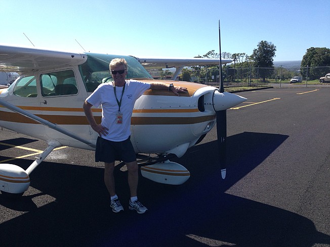 Texarkana native Ronald Trumble poses with his plane during a photoshoot.
