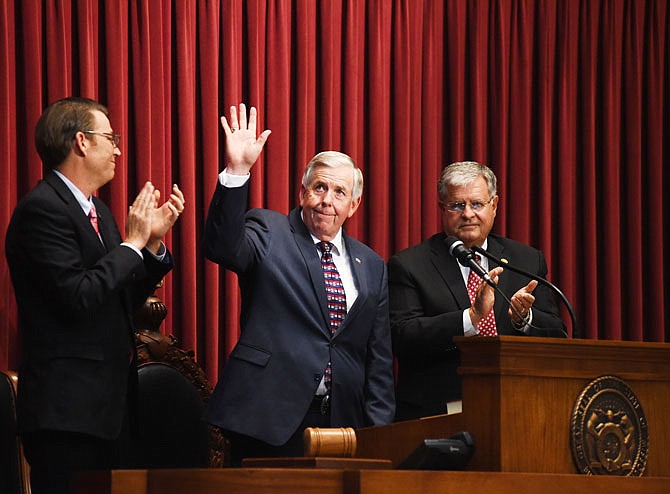 New Gov. Mike Parson waves to crowd members after giving his first joint-Legislature address Monday at the Capitol.