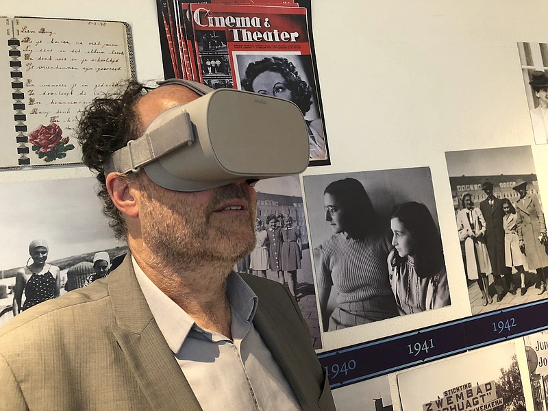 Ronald Leopold, executive director of the Anne Frank House, views a new virtual reality presentation of the secret rooms where teenage Jewish diarist Anne Frank hid from the Nazis during World War II, in Amsterdam on Tuesday, June 12, 2018. To mark what would have been Anne Frank's 89th birthday, the museum dedicated to her life has launched the virtual reality tour of the cramped quarters where the Jewish diarist and her family hid from Nazis during World War II. (Aleksandar Furtula/AP Photo)