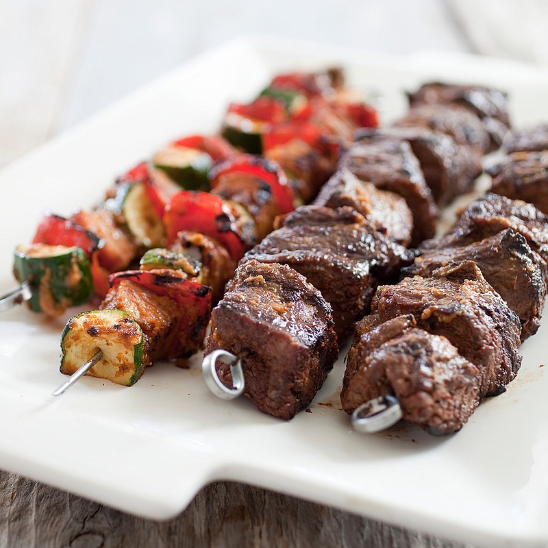 This undated photo provided by America's Test Kitchen in May 2018 shows grilled beef kabobs in Brookline, Mass. This recipe appears in the "The Complete Mediterranean Cookbook." (Carl Tremblay/America's Test Kitchen via AP)