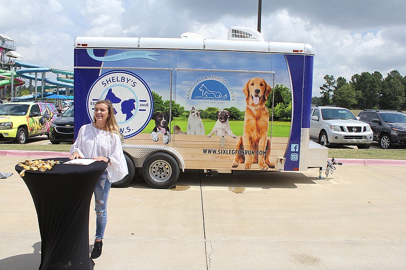 Shelby Dunphy-Day speaks after the unveiling of the Texarkana Animal Care and Adoption Center's new adoption trailer Tuesday at Arkansas Convention Center in Texarkana, Ark. Shelby's P.A.W.S., the organization Dunphy-Day founded, raised $32,000 to pay for the trailer, mainly through three annual "six leg" 5K races. Dunphy-Day organized the first race as a fifth-grade school project.