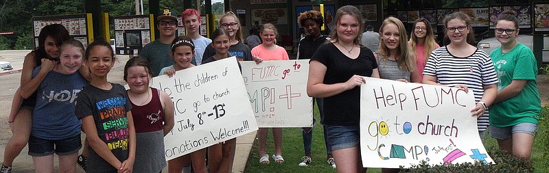 This is how many car-hops were ready to take your order at Atlanta's SonicDrive-In Saturday. The youth of Atlanta First United Methodist Church were trying to earn money for summer church camp in July and so worked all day for donations. It seems the customers said they liked the attention and fast service.
