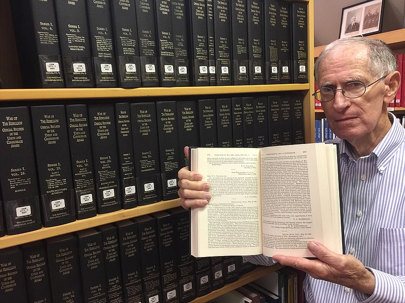 Cass County historian Charles Steger takes a moment to show the 47 volumes of "The War of the Rebellion: A Compilation of the Official Records of the Union and Confederate Armies," which the Atlanta library has.