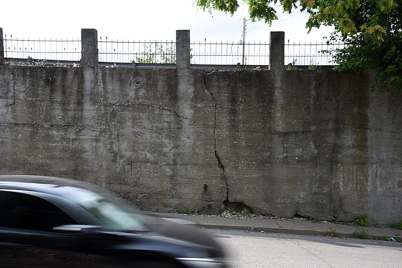 Emil Lippe/News Tribune
A driver makes their way down Monroe Street past the retaining wall between Highway 50 and Dunklin Street on Thursday, June 14, 2018. The retaining wall leans out about 2.5 feet.