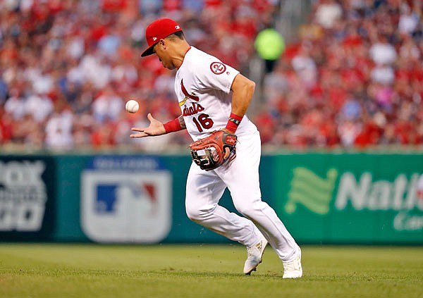 Cardinals second baseman Kolten Wong bobbles a grounder by Raffy Lopez of the Padres before throwing Lopez out at first to end the top of fourth inning of Wednesday night's game at Busch Stadium in St. Louis.