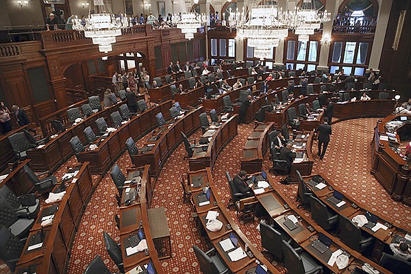 The Republican side, foreground, of the House chamber in the Illinois State Capitol in Springfield, Ill., is nearly empty as its members are in caucus, Thursday, May 31, 2018.