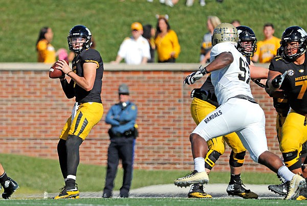 Missouri quarterback Drew Lock drops back to pass during the first half of a game last season against Idaho at Faurot Field. 