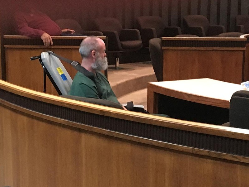 Reggie Smith sits in court in a restraint chair. Smith refused to walk into court Wednesday and 102nd District Judge Bobby Lockhart ordered Bowie County Sheriff's Office deputies to use the chair to effect Smith's appearance at a bench trial for burglary of a habitation with intent to commit aggravated assault. Lockhart found Smith guilty Thursday and sentenced him to a 45-year prison term.