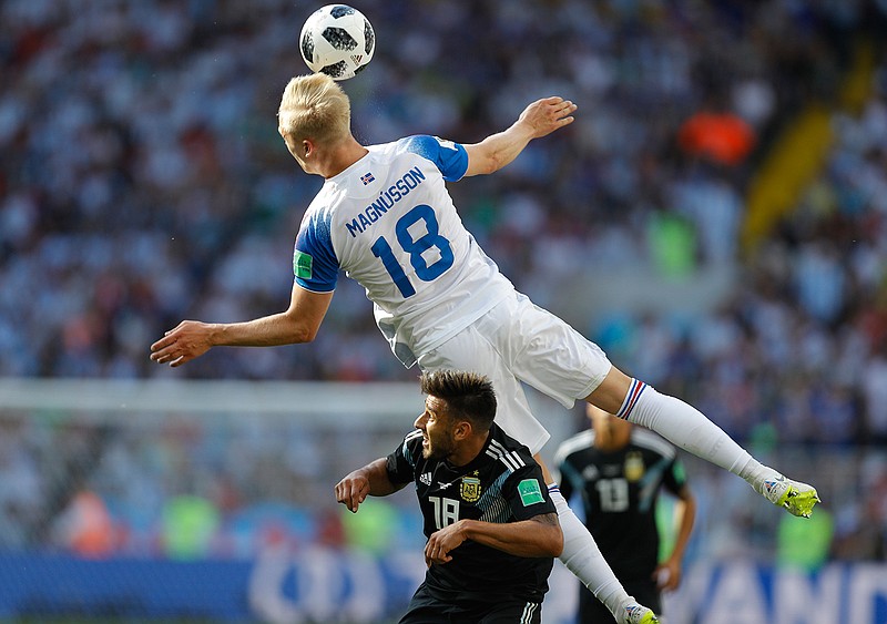 Iceland's Hordur Magnusson, above, vies for the ball with Argentina's Eduardo Salvio during the group D match between Argentina and Iceland at the 2018 soccer World Cup in the Spartak Stadium in Moscow, Russia, Saturday, June 16, 2018. (AP Photo/Victor Caivano)