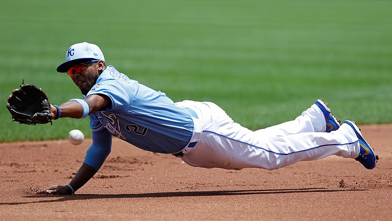  Kansas City Royals shortstop Alcides Escobar is unable to grab an RBI-single hit by Houston Astros' Yuli Gurriel in the first inning of a baseball game Sunday at Kauffman Stadium in Kansas City, Mo.