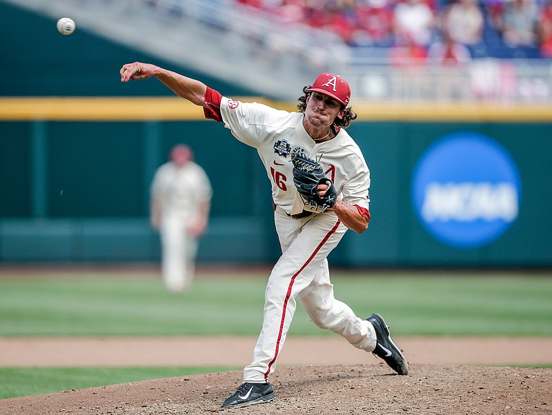  Arkansas pitcher Blaine Knight (16) delivers against Texas in the fifth inning of an NCAA College World Series baseball Sunday game in Omaha, Neb.