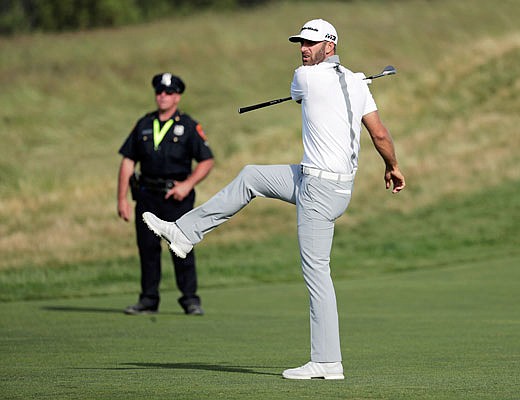 Dustin Johnson reacts to an approach shot on the 15th hole during Sunday's final round of the U.S. Open in Southampton, N.Y.