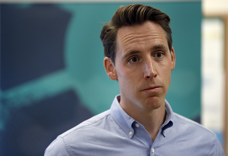 FILE - In a Friday, May 25, 2018 file photo, Missouri Attorney General and Republican U.S. Senate candidate Josh Hawley takes questions from the media in Macon, Mo.