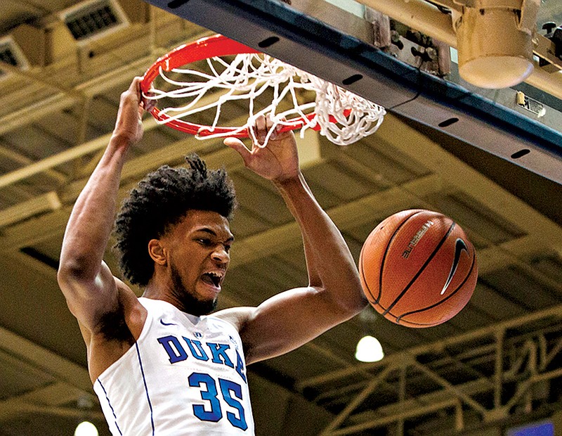  Duke's Marvin Bagley III (35) dunks the ball during the first half against Virginia in Durham, N.C. Bagley dominated at Duke, while fellow freshman Michael Porter Jr. barely saw action at Missouri because of injury. Yet they'll likely be the first forwards to hear their names called during Thursday's draft. Bagley is a possible No. 1 overall pick and double-double machine with a long frame. 