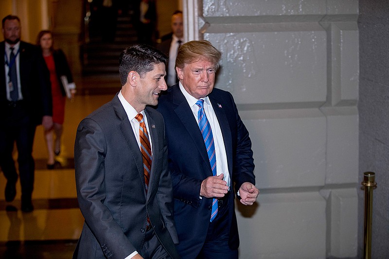 President Donald Trump, accompanied by House Speaker Paul Ryan of Wis., arrives on Capitol Hill in Washington, Tuesday, June 19, 2018, to rally Republicans around a GOP immigration bill.  (AP Photo/J. Scott Applewhite)