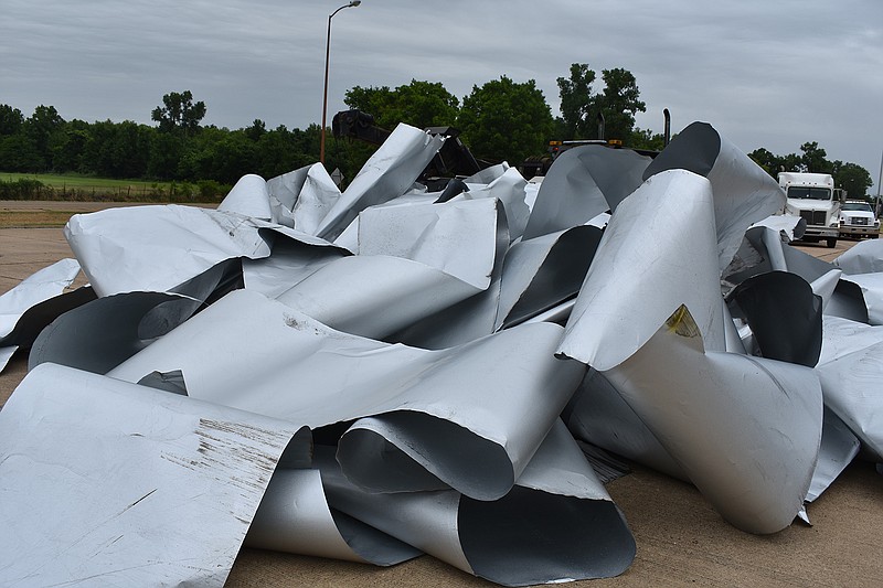 A flatbed tractor-trailer loaded with rolled aluminum turned over about 5:30 a.m. Tuesday on U.S. Highway 71 in Little River County, scattering the aluminum. The northbound truck entered a curve near the Arkansas Weigh Station when it overturned. The driver was not injured, and no other vehicles were involved. Sheriff's Deputy Austin Ardwin is investigating the accident.