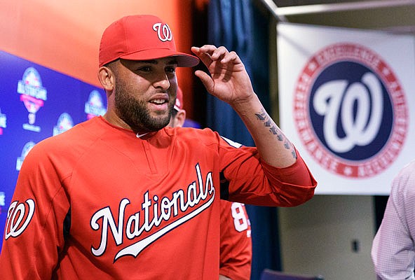 Kelvin Herrera of the Nationals leaves a news conference Tuesday in Washington.