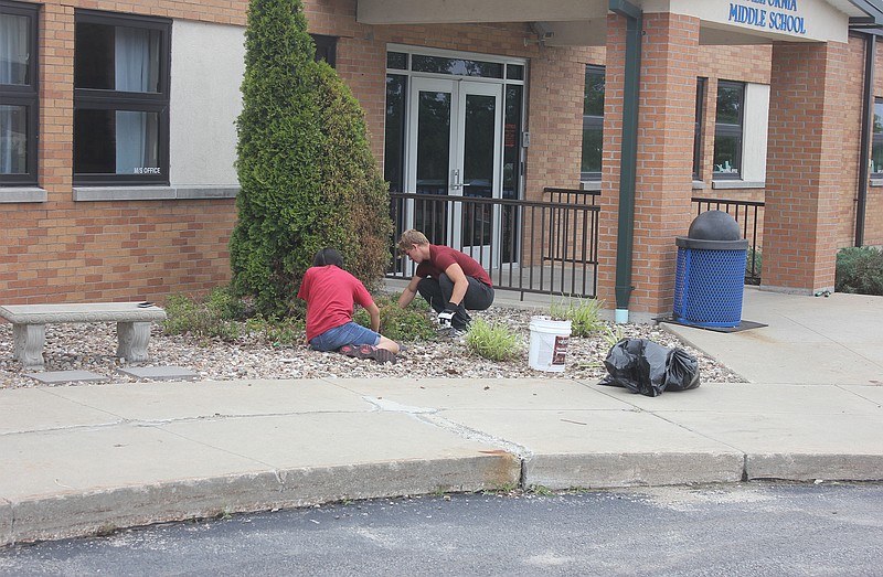 <p>Democrat photo/ Kevin Labotka</p><p>3MT volunteers provide some lawn care at the California Middle School, June 22.</p>