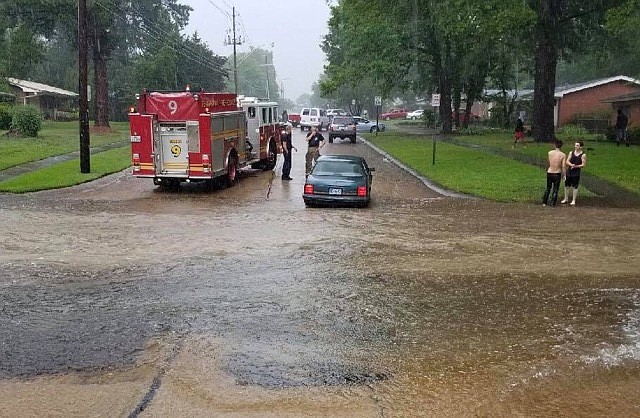 This photo courtesy of Texarkana, Texas, Police Department shows flooding on West 40th Street after heavy rains Wednesday, June 20, 2018.