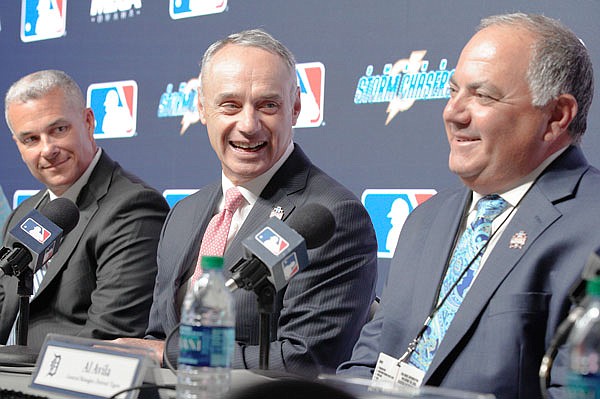 MLB commissioner Rob Manfred (center), Tigers general manager Al Avila (right) and Royals general manager Dayton Moore speak during a news conference Thursday in Omaha, Neb. It was announce the Tigers will play the Royals in Omaha the opening week of the 2019 College World Series.