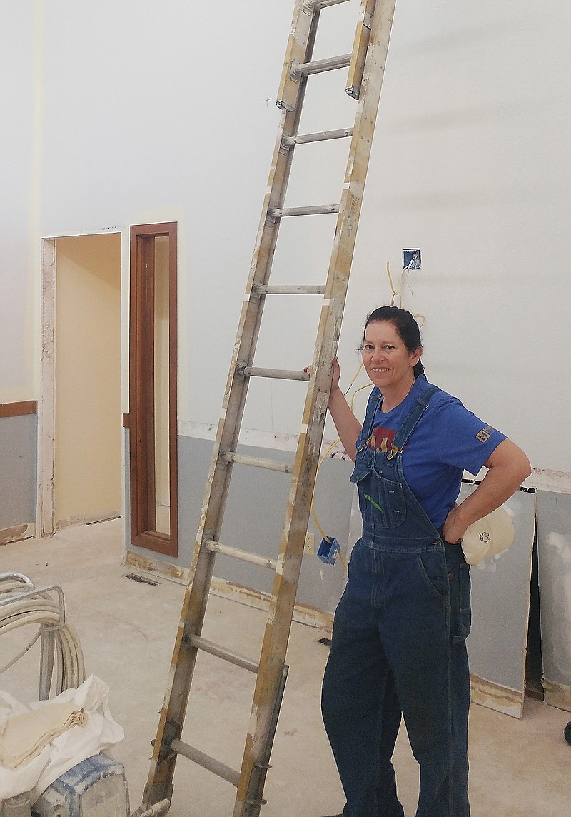 Phillip Sitter/News Tribune
Elizabeth Huber stands amid renovation work in what will be the main room of St. Nicholas Academy, a new boarding school for local underprivileged children. Huber is the school's president of St. Nicholas, located on Edgewood Drive in a building leased from Capital Region Medical Center. 