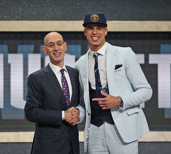 Missouri's Michael Porter Jr. poses with NBA commissioner Adam Silver on Thursday after he was picked 14th overall by the Denver Nuggets during the NBA draft in New York.