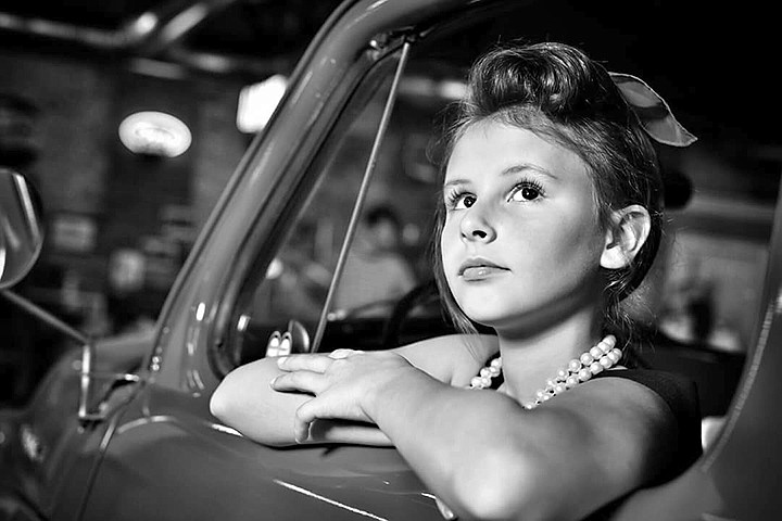 A young model poses June 10 at the Four States Auto Museum for Brett Anthony Martelli of Brett Martelli Photography. This engagement was one of the stops Martelli took on his tour of the South.