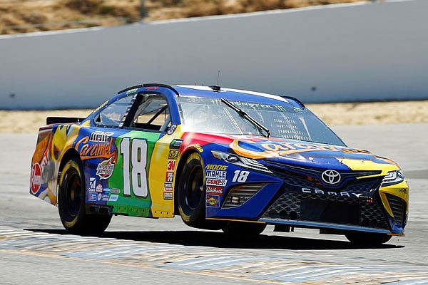 Kyle Busch gets a little air above the rumble strips exiting Turn 4 during afternoon practice Friday at Sonoma Raceway in Sonoma, Calif.