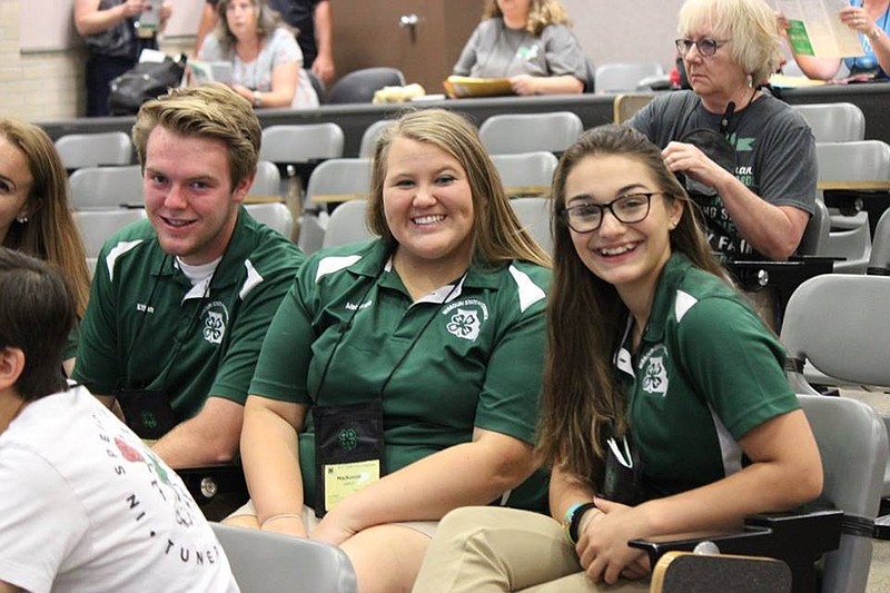 <p>Submitted photo</p><p>MacKenzie Loesch sits between 2017-2018 East Central Regional Representatives Ethan Walker and Kaitlyn Walmper at the 73rd annual State 4-H Congress in Columbia.</p>
