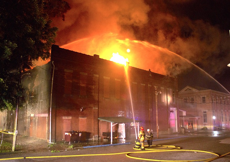 Firefighters battle to contain a blaze inside the California Fraternal Order of Eagles building which broke out Sunday night, June 24, 2018.