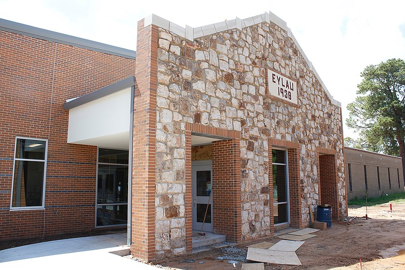 The front of the new Liberty-Eylau Elementary School, also known as the "Rock School," features stones from the previous building, which was built in 1938 as a Works Progress Administration project. The plaque on the front is also from the old school and serves as a focal point for the rock facade.