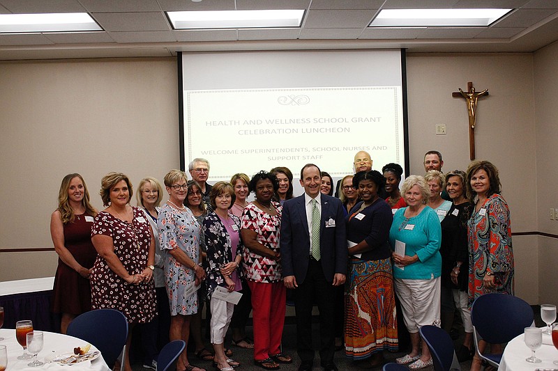 Representatives from area schools gather Tuesday at CHRISTUS St. Michael to receive a total of $45,000 in grants for the Mobile Pediatric Asthma Program. One of only two such programs in Texas, it makes asthma screenings and evaluations available on site at no charge to participants.