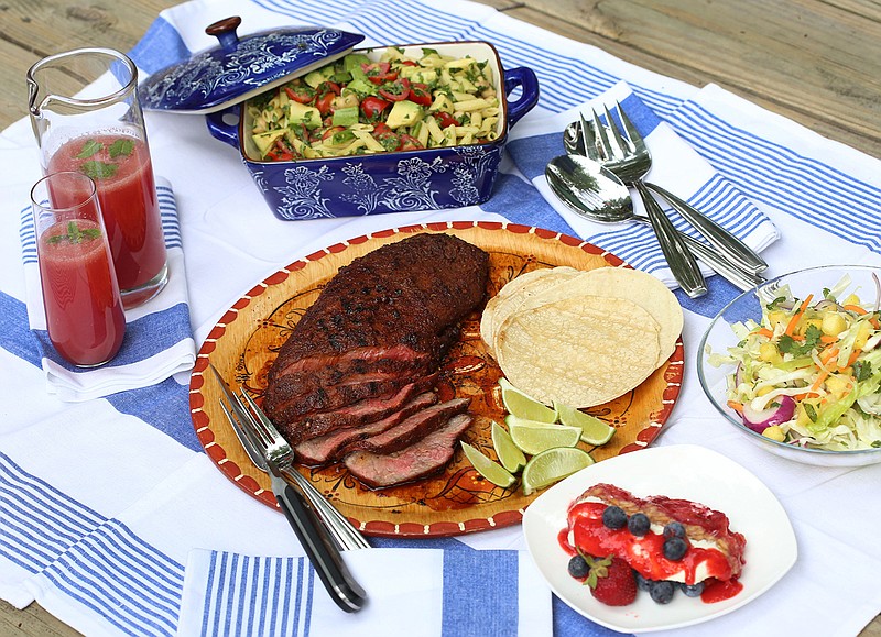 The tastes of a backyard July 4th, clockwise from top left: Watermelon-Cucumber and Vodka Cooler; Spinach and Avocado Penne Pasta Salad; Spicy Pineapple Slaw; Strawberry Pretzel Terrine, Chili-Lime Flat Iron Steak. (Jessica J. Trevino/Detroit Free Press/TNS)