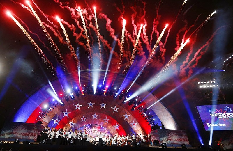 Fireworks explode over the Hatch Shell during rehearsal for the Boston Pops Fireworks Spectacular in Boston, Tuesday, July 3, 2018.