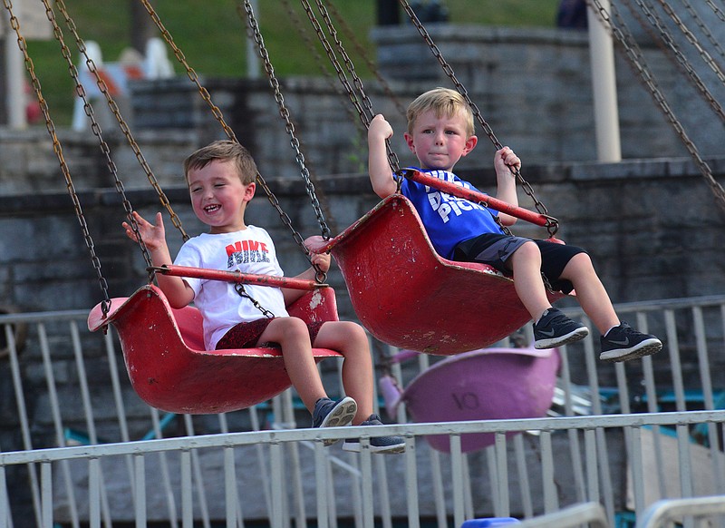 July Fourth thrill seekers try out the carnival rides on the midway at Salute to America Carnival Land 
on the eve of Independence Day in 2018.