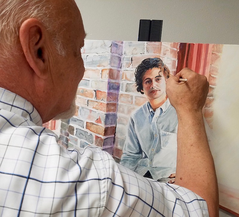 Danny Helms paints a portrait of fellow Texarkana artist Jasi Hernandez at the 1894 Gallery. It's one of the works to be shown at the upcoming Artists Visualizing Artists Show on July 13.