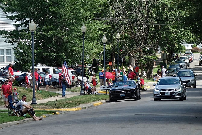Crowds begin to gather along Court Street for the annual Independence Day Parade, which started at 11 a.m. Wednesday at William Woods University and concluded at Memorial Park. David Beaver and several of his friends began the parade in 2012, and this year several officer veterans who served 20 years or more were honored.