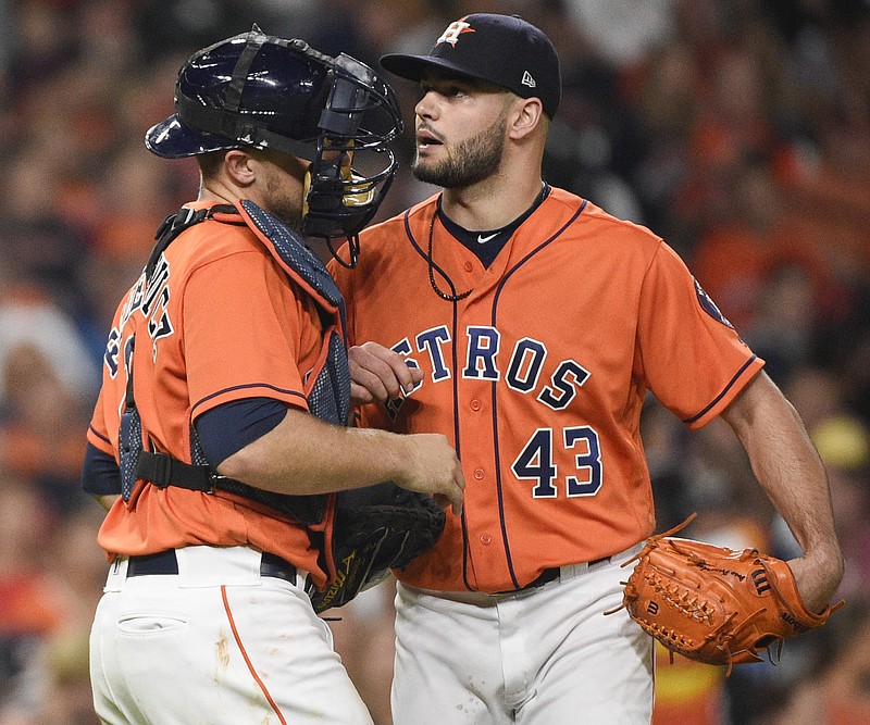 Houston Astros starting pitcher Lance McCullers Jr. (43) talks with catcher Tim Federowicz after Chicago White Sox's Adam Engel scored a run during the sixth inning of a baseball game Friday, July 6, 2018, in Houston. (AP Photo/Eric Christian Smith)