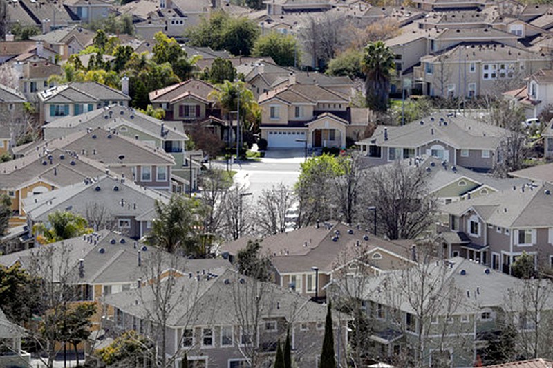 In this Tuesday, March 6, 2018, photo homes stack up in a neighborhood in San Jose, Calif. NerdWallet calculated affordability for 172 metropolitan areas by comparing the median annual household income and the monthly principal-and-interest payment for a median-priced single-family home and found that the least affordable homes are in the San Jose. (AP Photo/Marcio Jose Sanchez)